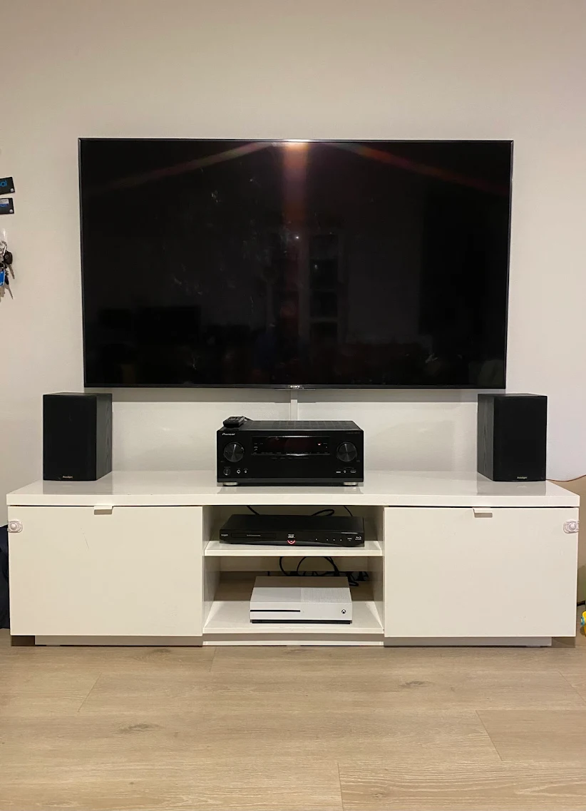 Home Theatre System installed with Sony TV wall mounted above a timber entertainment unit in a modern Sydney living room