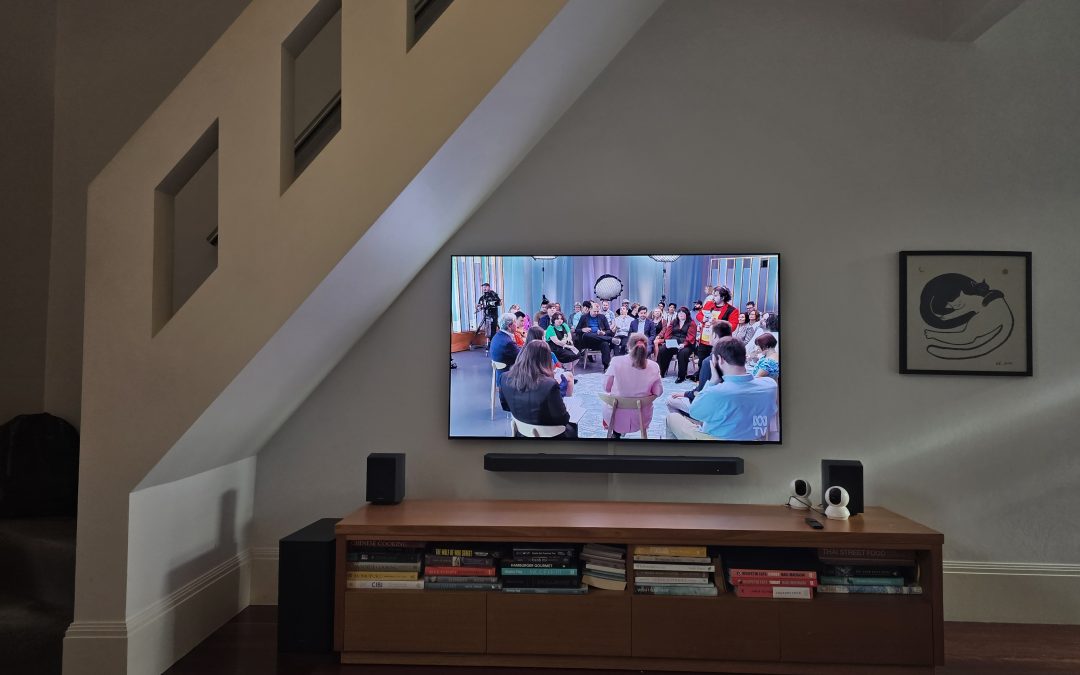 65-inch Samsung QLED TV & Soundbar wall mount installation on rendered brick wall