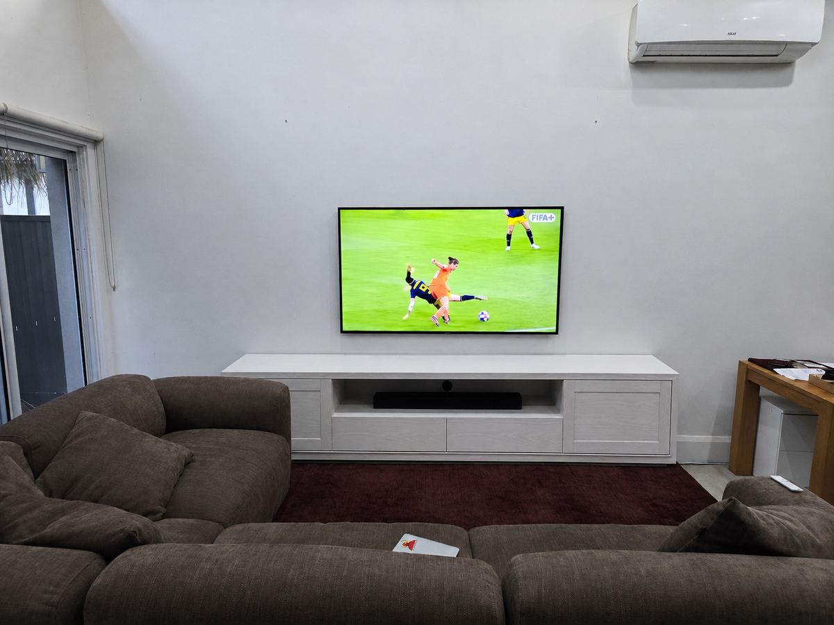 Samsung Frame TV Wall Installation Sydney 65 inch Samsung Frame TV LS03HE 4K wall mounted on a gyprock wall in a Sydney living room
