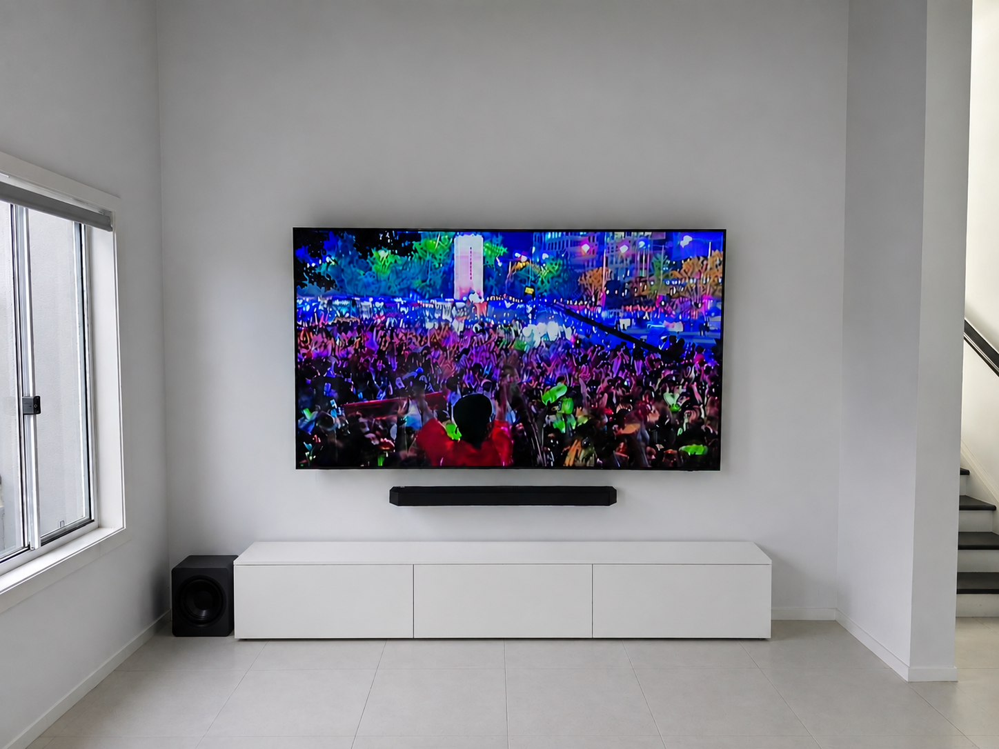 100-inch Samsung QLED TV wall mount installation on gyprock wall with soundbar